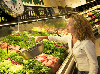 woman buying food to use in a pressure cooker